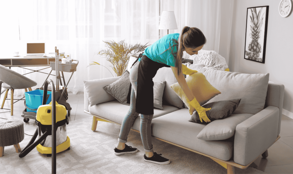 A woman cleaning a living room for a Regular and Standard Cleaning in Glasgow